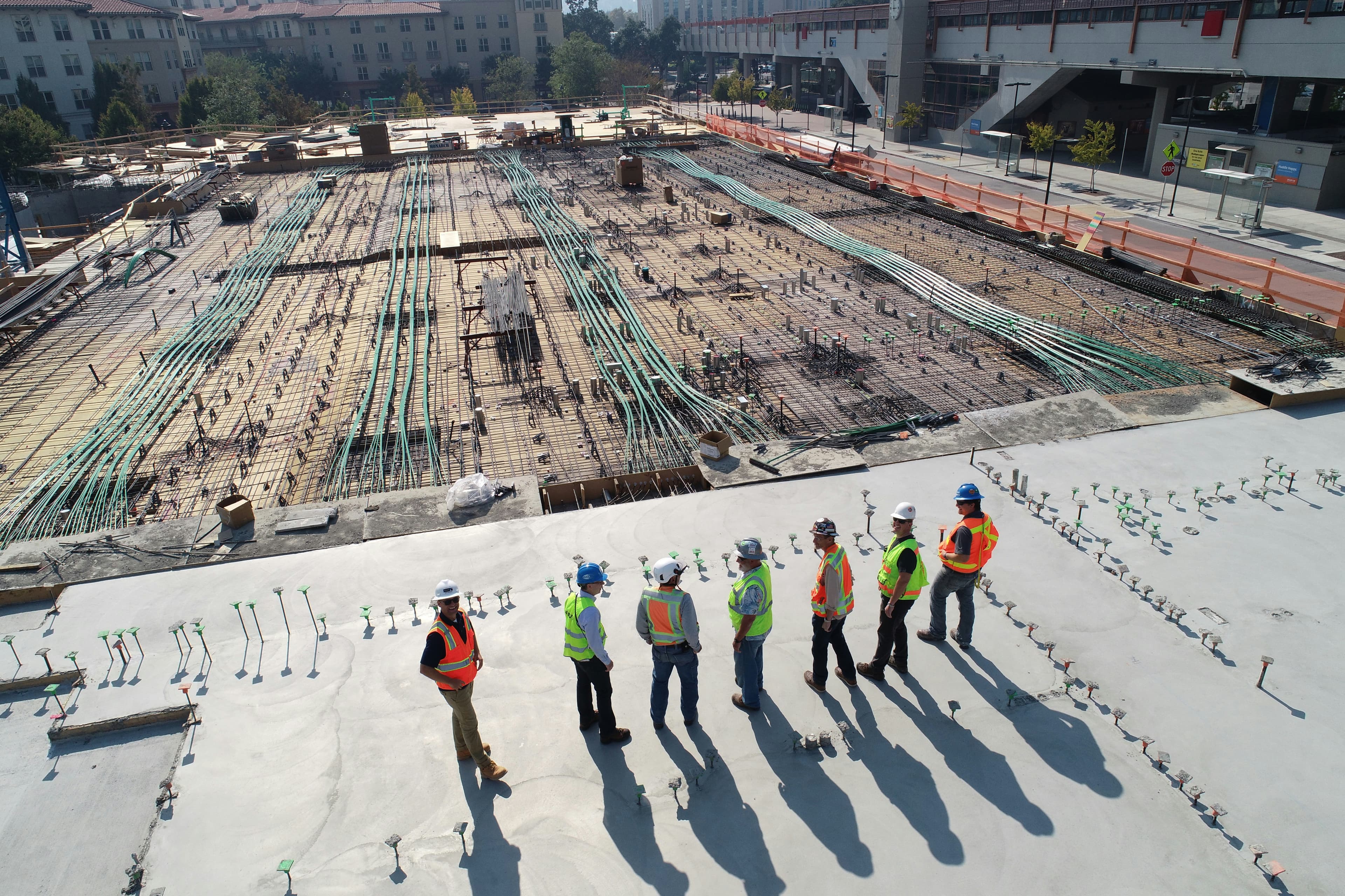 Construction professionals inspecting a large building site