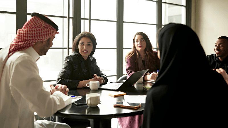 Business team discussing a project around a meeting table