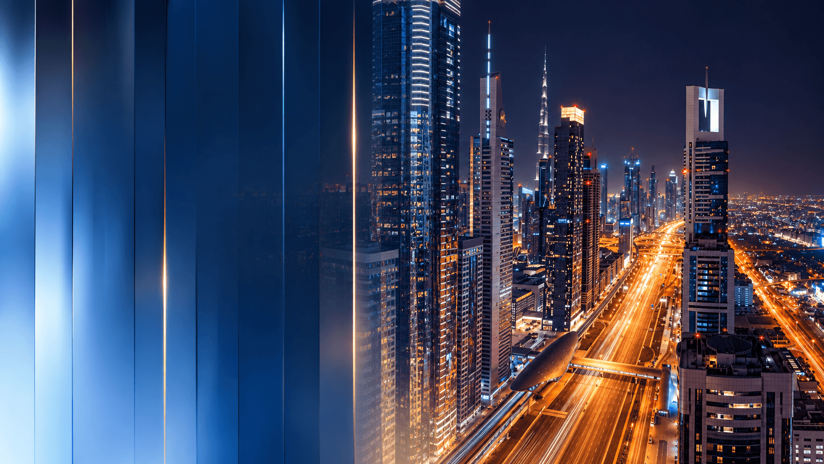 Dubai skyline and illuminated city roads at night